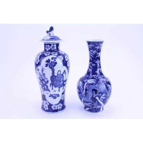 227 - A Chinese Export blue and white vase with cover along with a similar vase.