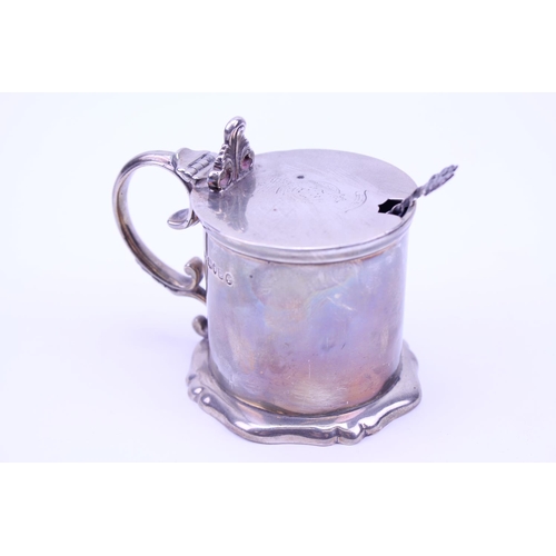 21 - A Silver Cylindrical Victorian Mustard Pot with engraved crest. Makers: Hunt & Roskell. Weighing: 21... 