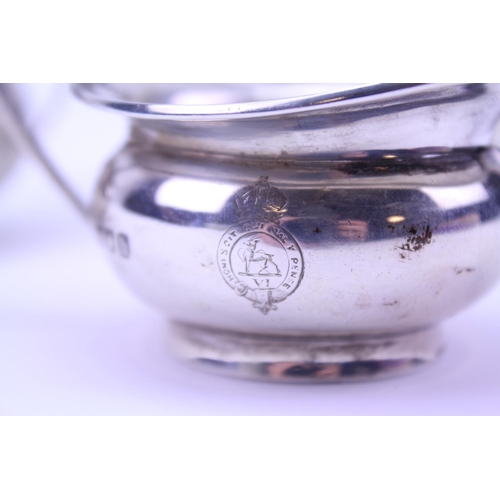 22 - An Early Morning Silver Tea Set of Georgian inspiration, crested London h. Weighing: 554 grams. (Gro... 