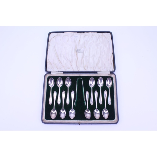 5 - A Set of 12 Beed Edged & Shell decorated Silver Tea Spoons & Tongs in Original Case. Weighing: 196 g... 