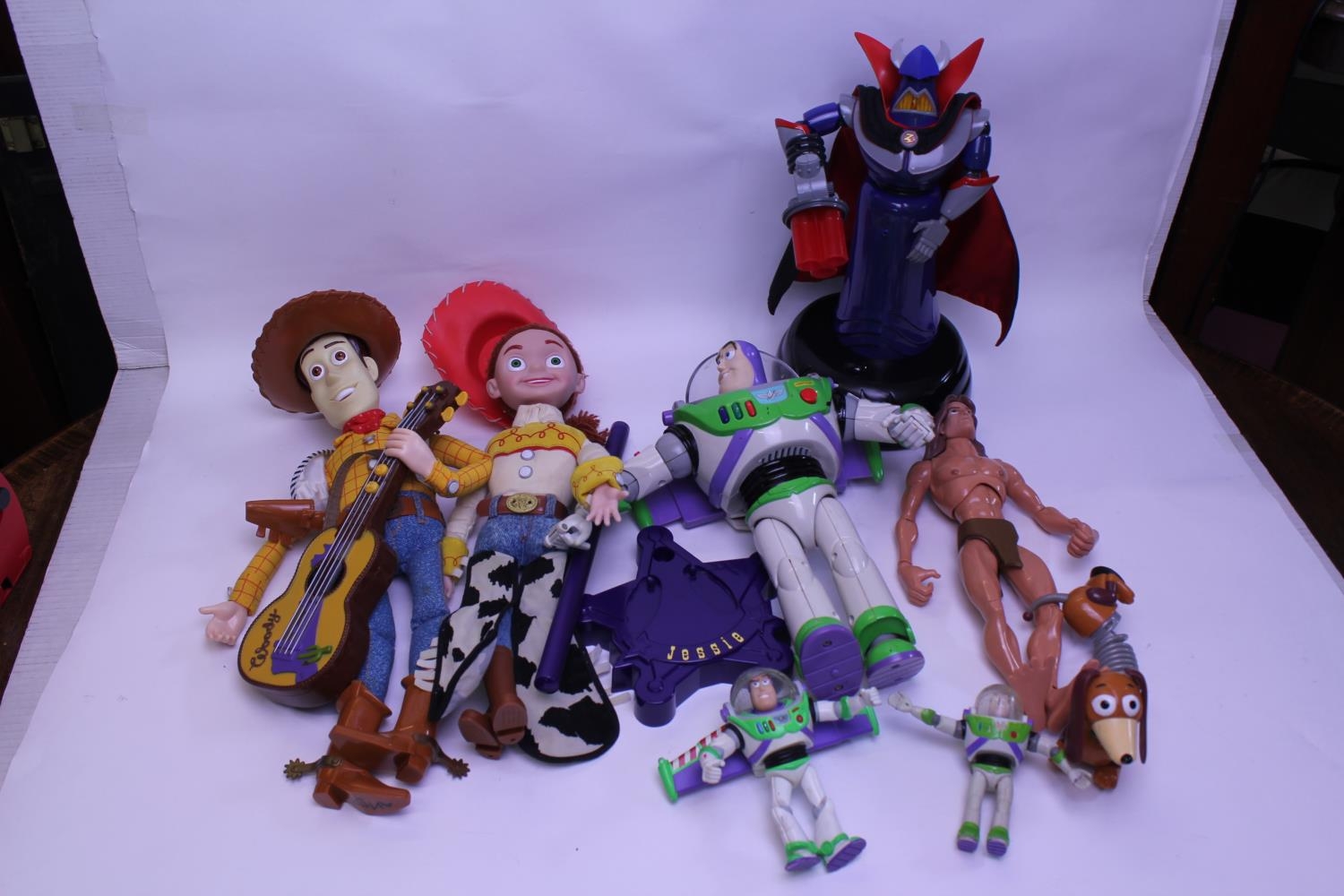 A collection of THINKWAY toys Disney figures, to include buzz lightyear