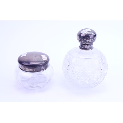 13 - A Silver mounted & Topped Hair Tidier along with a Silver Cut Glass Cologne Bottle.