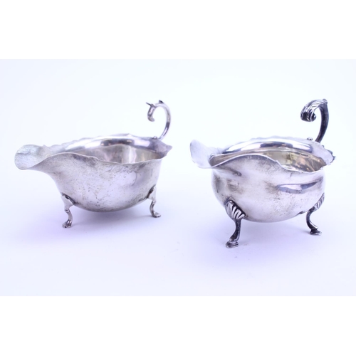 21 - Two Silver Georgian pattern Sauce Boats. Total weight approximately: 210 grams.