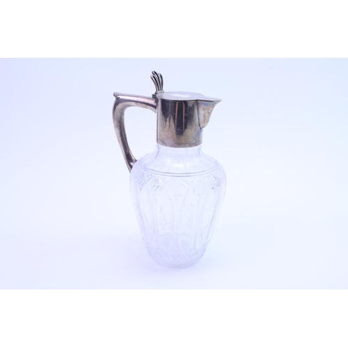 23 - A Silver Mounted (800) mark Cut Glass Claret Jug with Flip Lid.