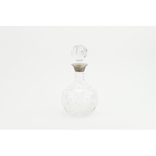 7 - A Silver Mounted Cut Glass Decanter & Stopper.