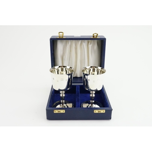 12 - A Pair of Silver Charles I design Wine Goblets. Hallmarked Birmingham h. Weighing 380 grams. Contain... 