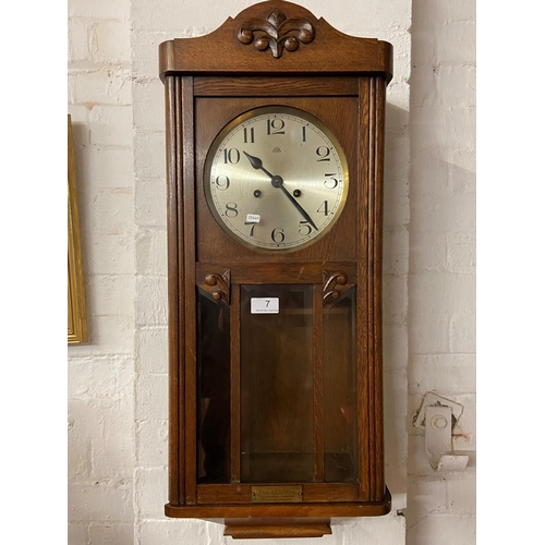 7 - CASED HALLERAG WALL CLOCK WITH KEY AND PENDULUM A/F