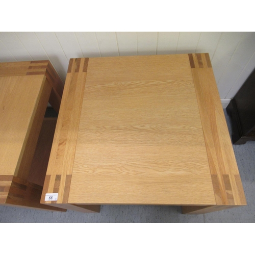 A pair of modern light oak coffee tables, raised on square legs 19"h 23"sq