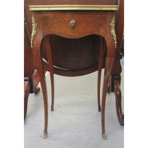 18 - A late 19thC Continental kingwood and marquetry, serpentine outlined vanity table, the hinged top en... 