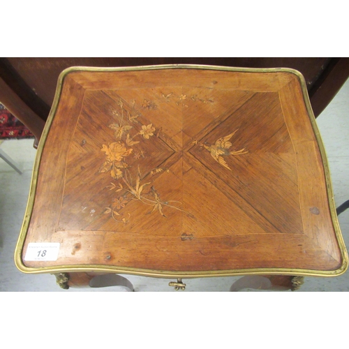 18 - A late 19thC Continental kingwood and marquetry, serpentine outlined vanity table, the hinged top en... 