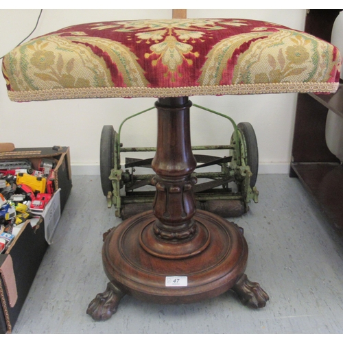 47 - A William IV rosewood stool with a tapestry upholstered top over a tulip carved column, on lion paw ... 