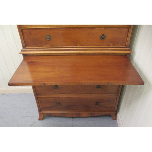 3 - A modern reproduction of a 19thC yewwood finished tallboy, comprising two short/over seven graduated... 