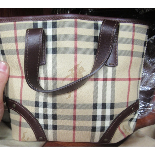 36 - Ladies handbags and purses: to include a Burberry Tartan handbag and dust cover 