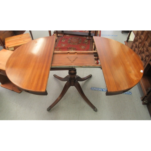 43 - A Regency design, faux drum top mahogany dining table, comprising a pair of D-ends, raised on a quad... 