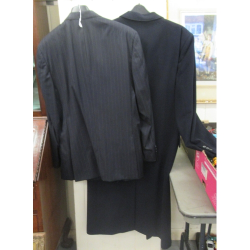 53 - A gentleman's Jaeger dark blue cashmere full-length coat  size 56; and a Jaeger two piece suit, the ... 