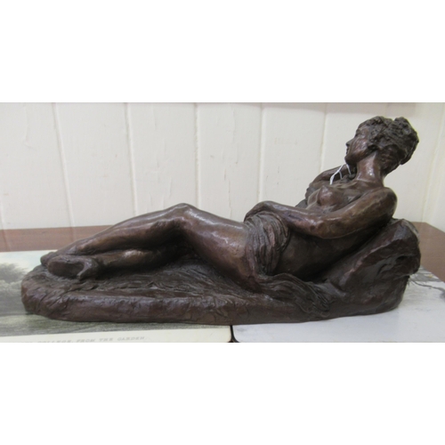 8 - B G Harrison (after Manon) - a cast and patinated bronze figure, a reclining nude  bears a signature... 