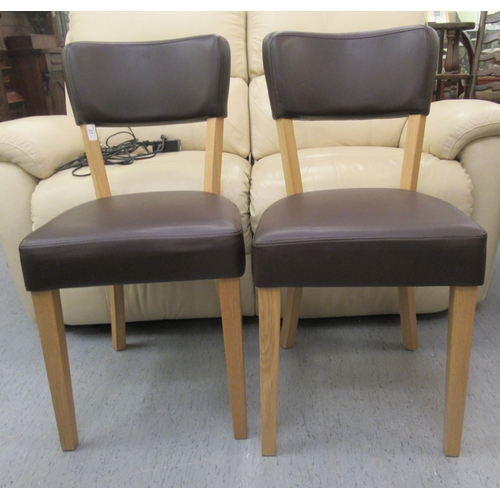 A pair of Ikea light oak framed dining chairs with black vin... Barnebys