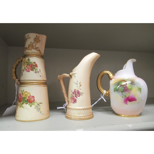 1 - Three dissimilar Royal Worcester china cream jugs, one handpainted with flora, signed J Lander 