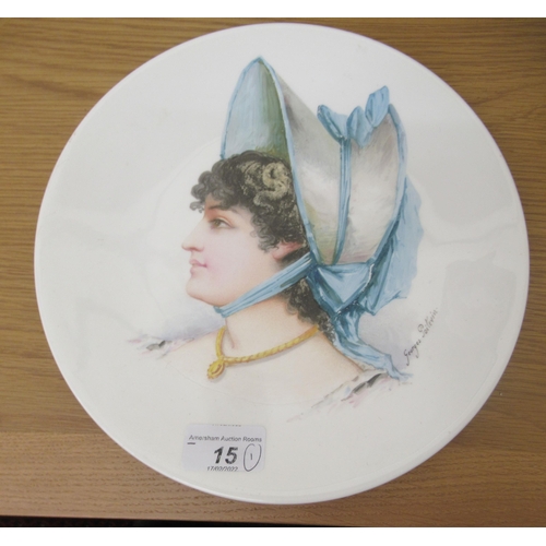 15 - A Mintons china plate, depicting a profile of a woman, signed 'Georges Poitevin'  9.5