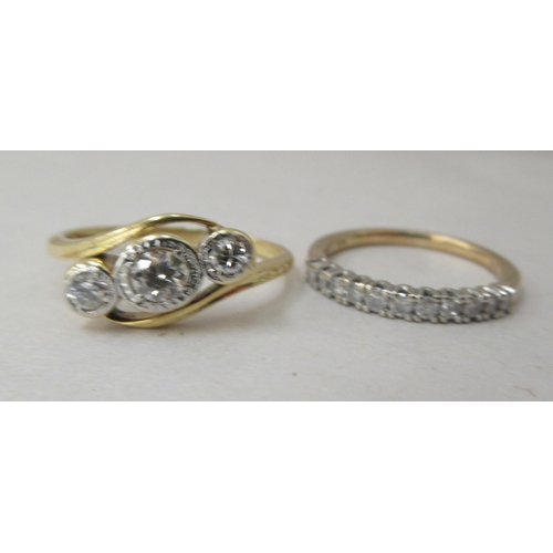 3 - A 10ct gold and platinum three stone diamond ring; and a 9ct gold diamond set half eternity ring&nbs... 