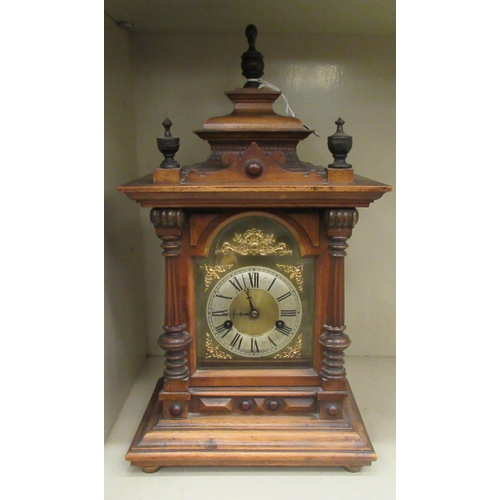 41 - An early 20thC oak cased mantle clock; the Wurttemberg of Germany movement, faced by a Roman dial  1... 