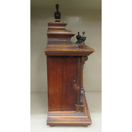 41 - An early 20thC oak cased mantle clock; the Wurttemberg of Germany movement, faced by a Roman dial  1... 