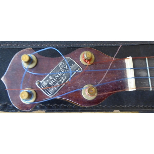 13 - A Sunray hardwood and gilt metal ukulele  cased 