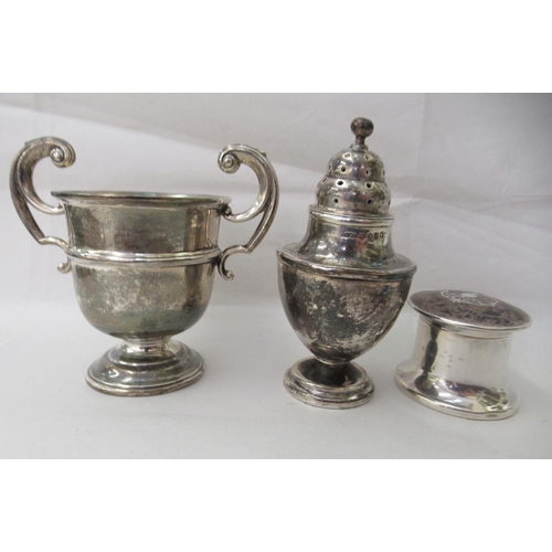 15 - Silver collectables: to include a Victorian pepper pot of urn design  London 1883 