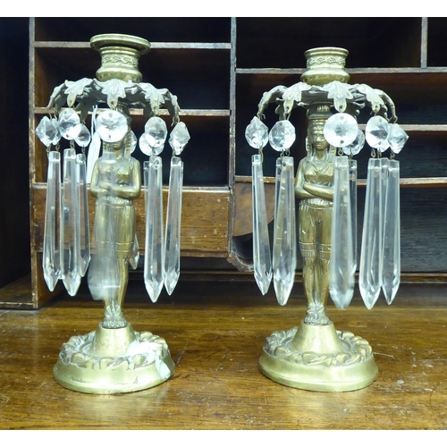 4 - A pair of late 19thC Egyptian design lacquered brass candlesticks, each with lustre glass pendants  ... 