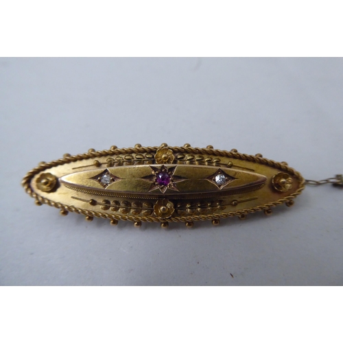 14 - Two late Victorian/Edwardian 15ct gold bar brooches, variously set with seed pearls and coloured sto... 