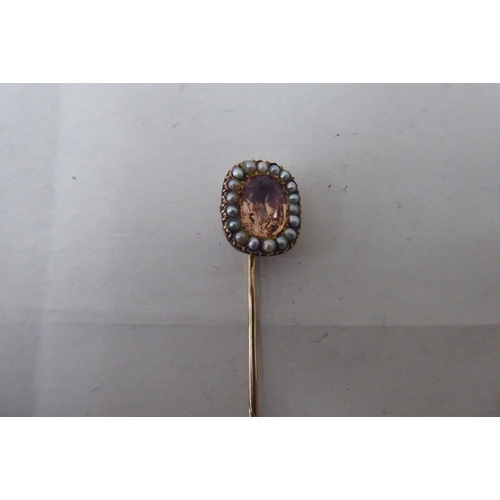 20 - Five dissimilar gold and yellow metal stickpins: to include an 18ct gold example, incorporating a ho... 