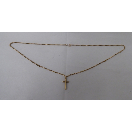 21 - A 9ct gold pendant cross, on a 9ct gold belcher link chain 