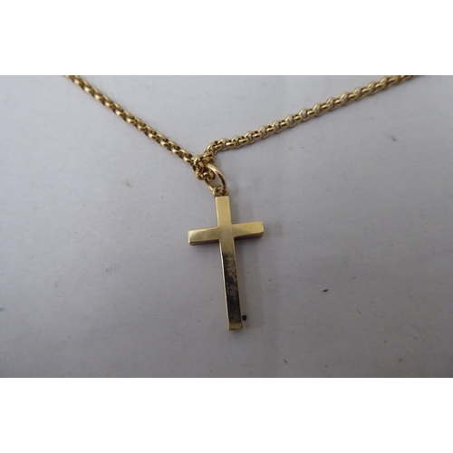 21 - A 9ct gold pendant cross, on a 9ct gold belcher link chain 