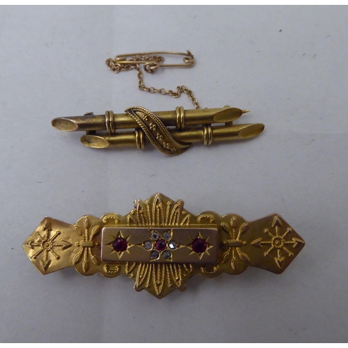 27 - Two dissimilar Edwardian 9ct gold bar brooches, one set with red and white stones 
