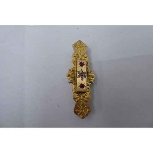 27 - Two dissimilar Edwardian 9ct gold bar brooches, one set with red and white stones 