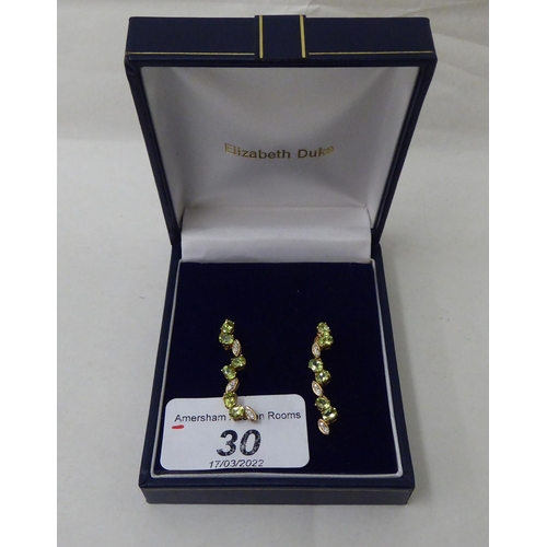30 - A pair of 9ct gold peridot and white stone pendant earrings 