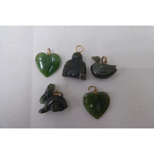 36 - Five jade coloured pendants
