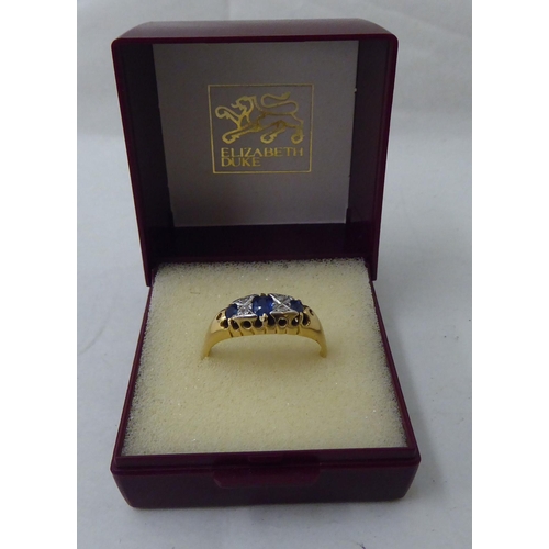 42 - An 18ct gold sapphire and white stone ring 