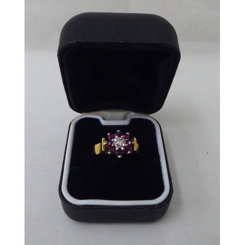 47 - An 18ct gold diamond and ruby cluster ring 