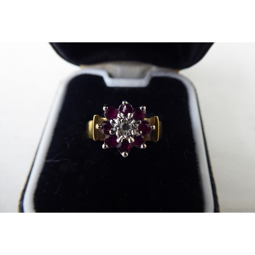 47 - An 18ct gold diamond and ruby cluster ring 