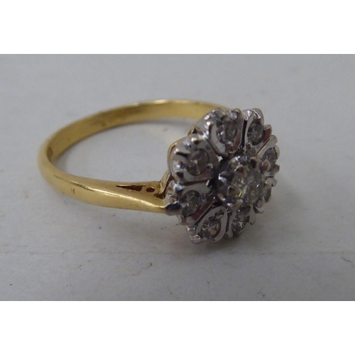 55 - An 18ct gold and platinum diamond cluster ring 