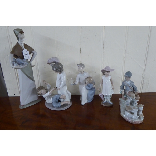 11 - Four Lladro, three Nao and two probably Valencia porcelain figures  largest 14