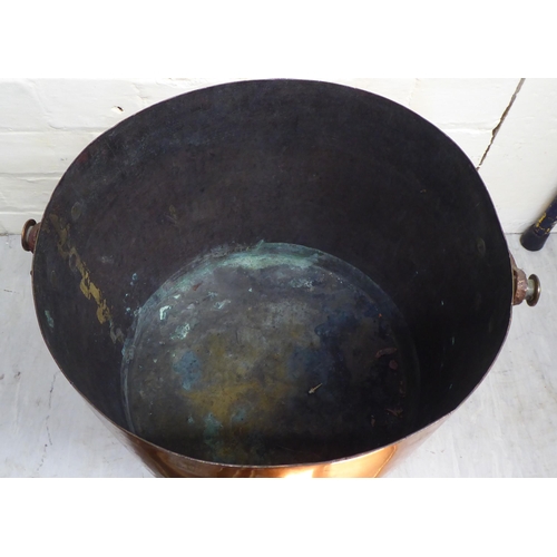 13 - 19thC and later metalware: to include a copper cooking pot with an iron swing handle  13
