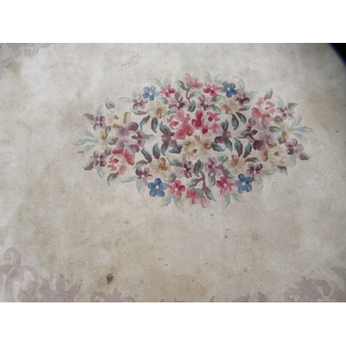 38 - A Chinese washed cotton rug, decorated in traditional taste in pastel tones  86