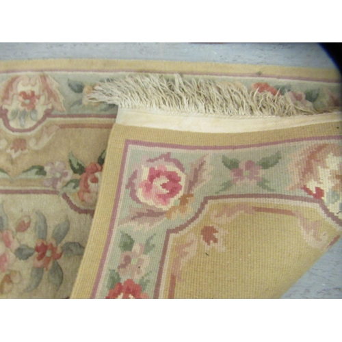 43 - Two similar Chinese washed cotton rugs, decorated with flora in pastel tones  30