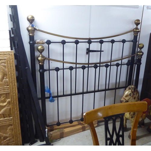 51 - A modern black painted and tubular brass double bed frame  the headboard 54