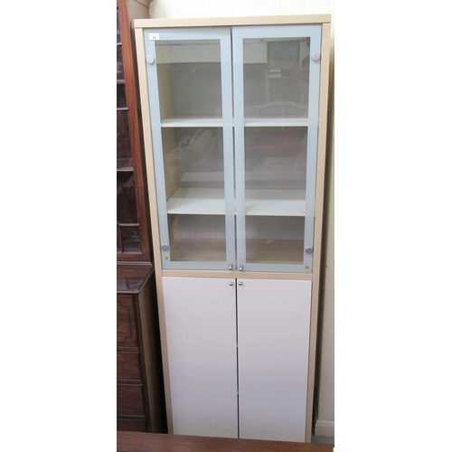 54 - A modern laminated beech effect and partially glazed display cabinet with an arrangement of open she... 