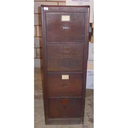 55 - An early 20thC stained oak and teak four drawer filing cabinet, on a plinth  52