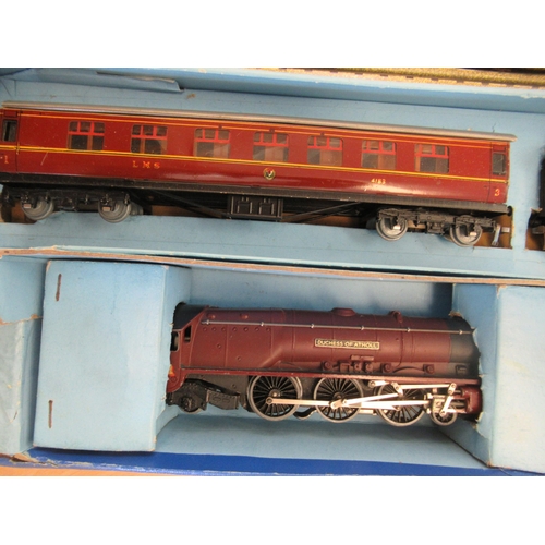 A Hornby Dublo electric model train set with a Duchess of Atholl an LMS tender; carriage