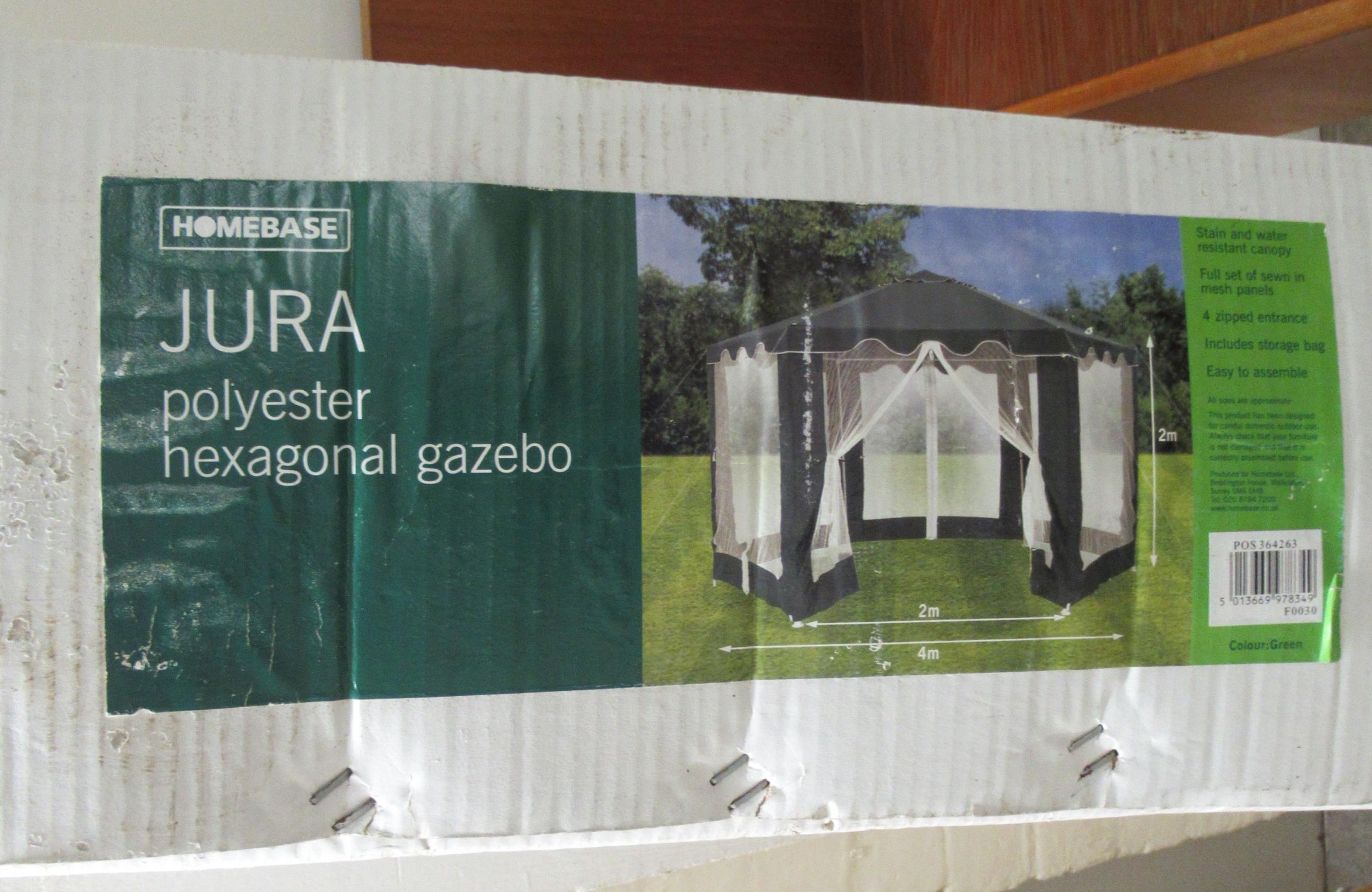 An unassembled Homebase Jura polyester, hexagonal gazebo boxed